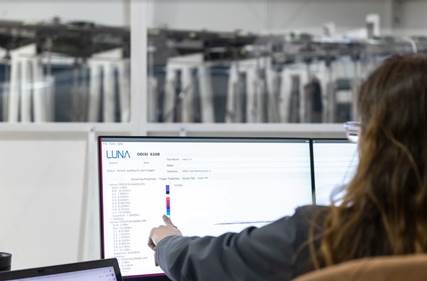 Image of engineer taking strain measurements using Luna's ODiSi sensing system on Boom's supersonic jet